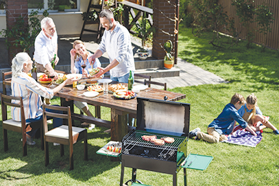 family enjoying backyard bbq