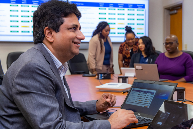 Picture of executive in front of a laptop