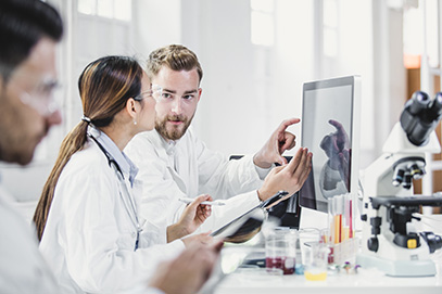 people in lab working together on new idea