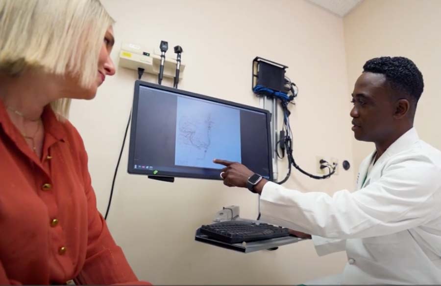 Neurointerventional surgery Doctor Blaya patient and Doctor Ajiboye reviewing her case of hemorrhagic stroke