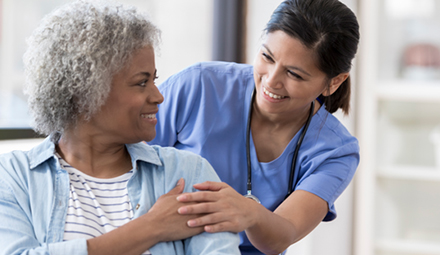 clinician touching patients shoulder