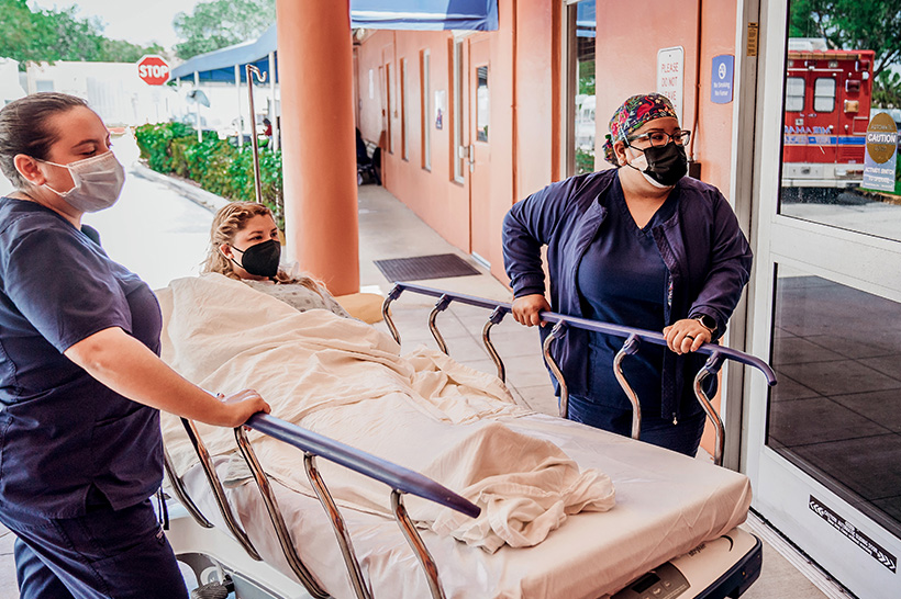 Memorial nurses transferring a patient