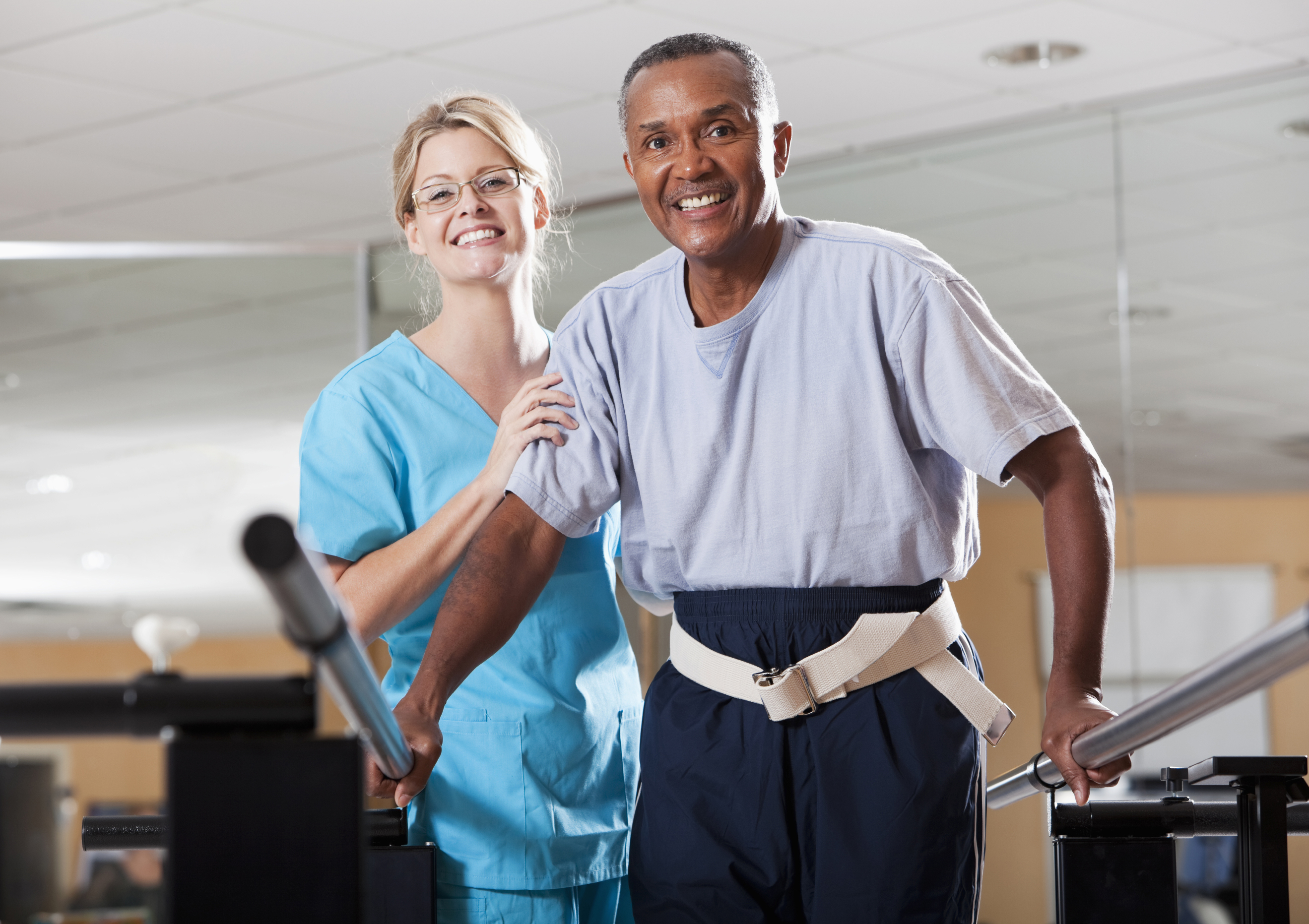 man in physical therapy with therapist